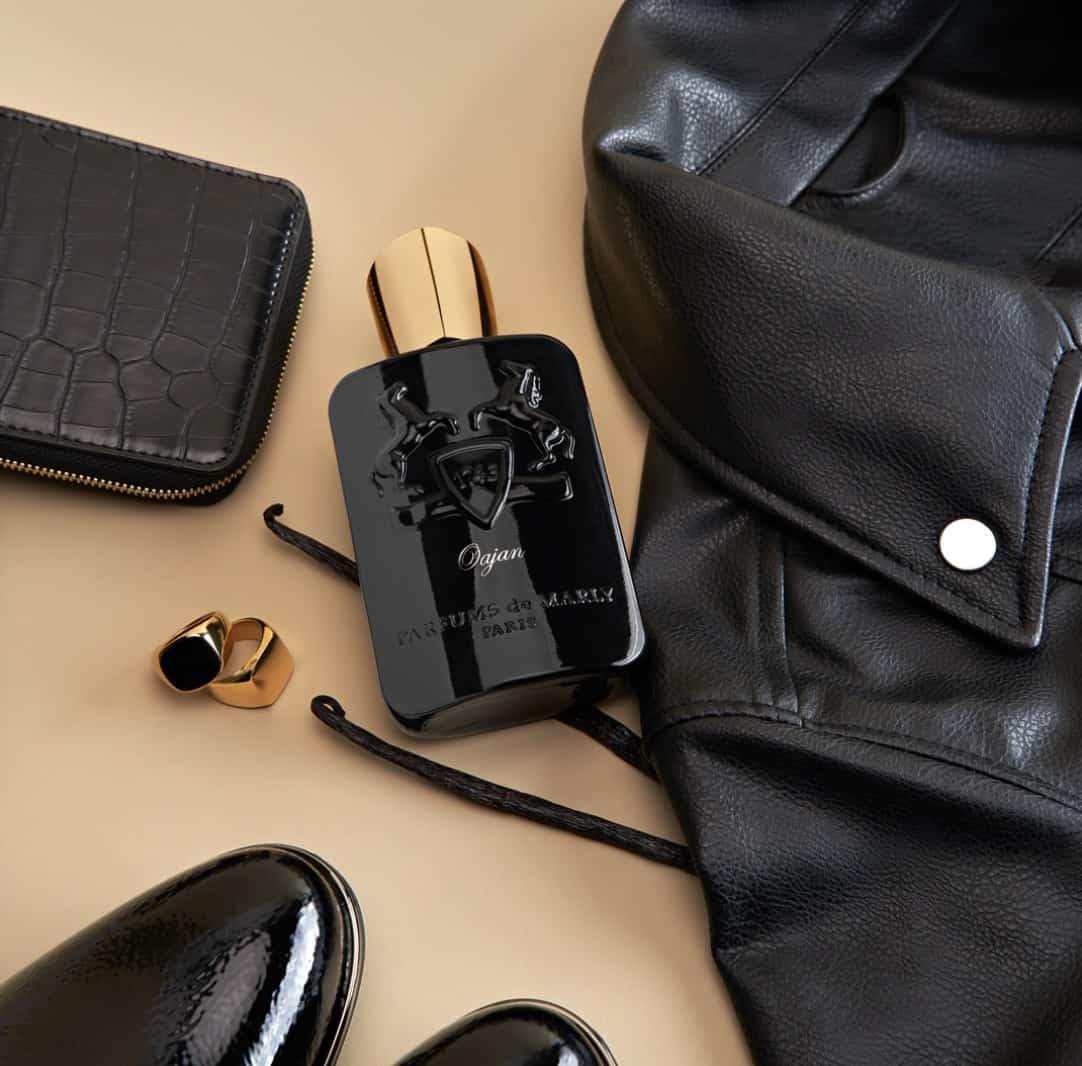 flat lay of mens clothes and cologne